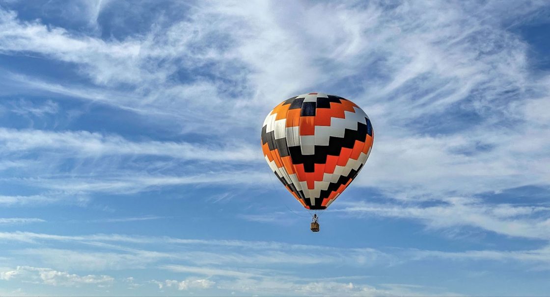 A three-colored air balloon in the sky