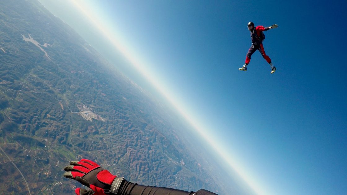 a person flying in a wingsuit