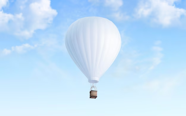 White hot air balloon among the clouds