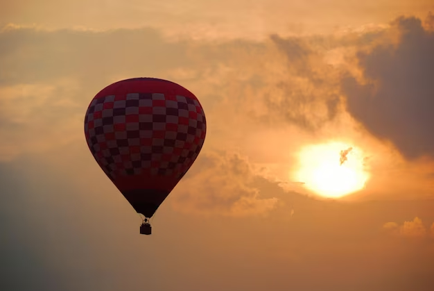 Hot air balloon on sunset background