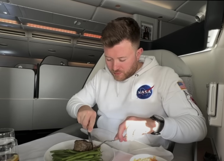 Man eating on a plane