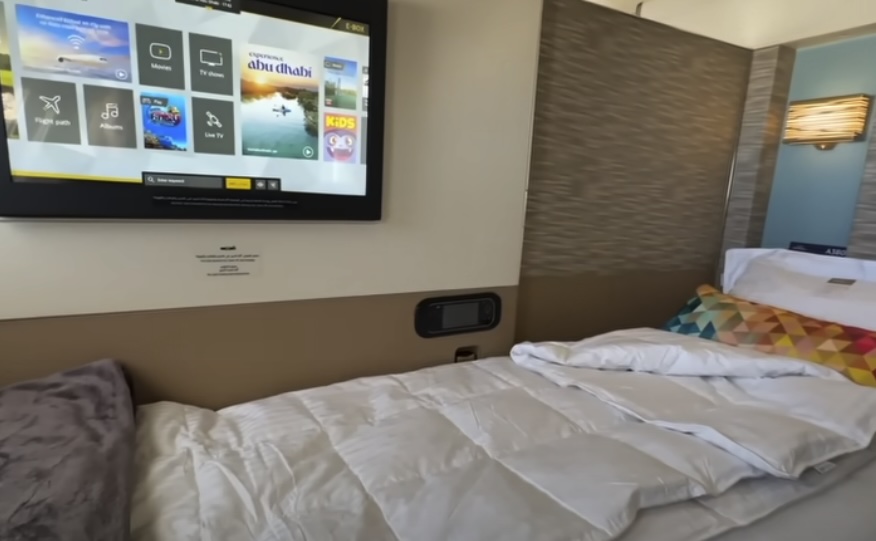 Airplane bed with TV next to it